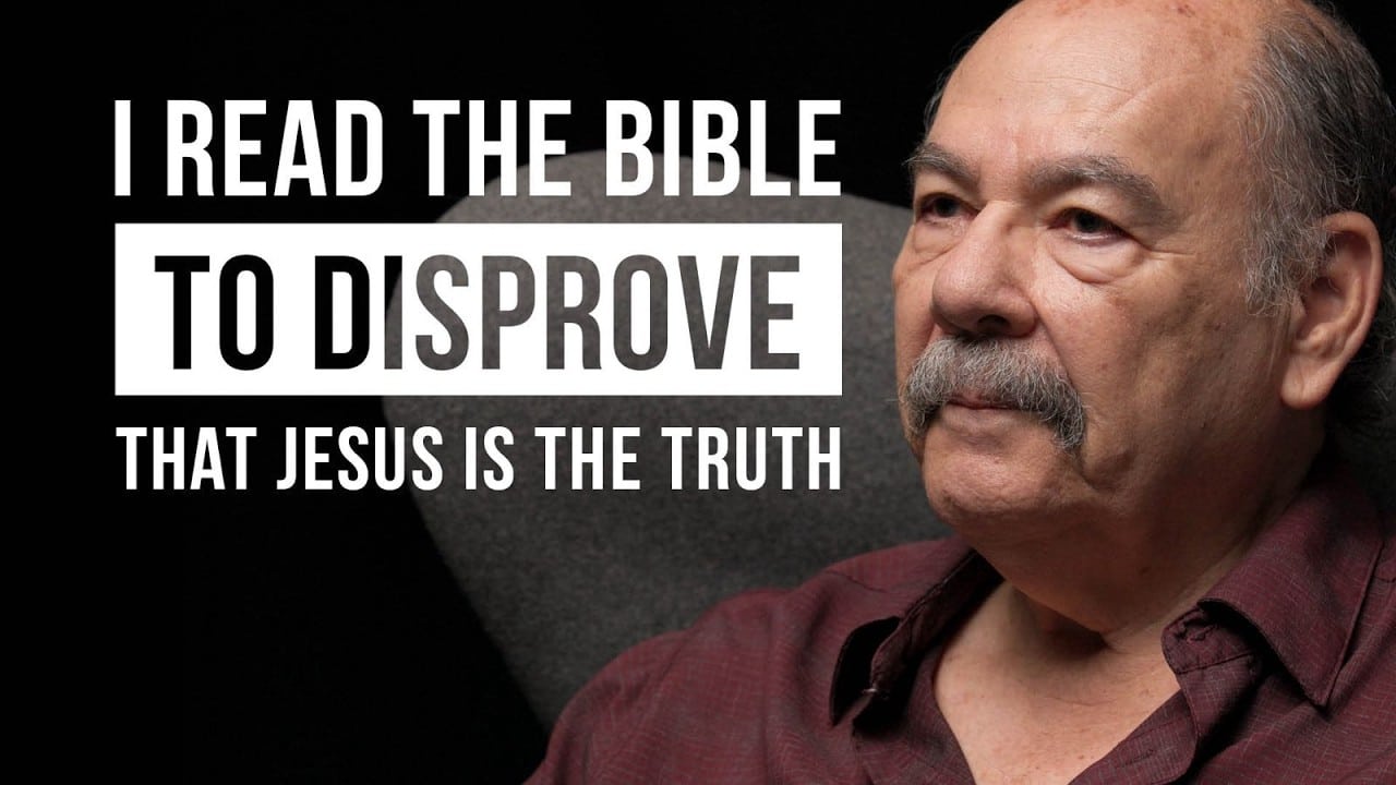 Man with mustache in maroon shirt sits to the right; bold text on left reads: 'I READ THE BIBLE TO DISPROVE THAT JESUS IS THE TRUTH'
