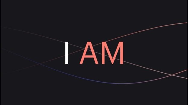 Dark background with the bold white letter I and coral AM forming the phrase I AM, crossed by curved lines in red and blue shades behind it.
